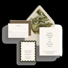 the wedding stationery is set up with two envelopes and one lettered card