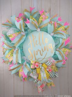 a wreath with the words hello spring on it