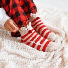 Custom Fuzzy Reindeer Socks cute personalized gift idea for friends and family this Christmas holiday season. Get them for your best friends to match at a sleepover or for Christmas morning with the family. Pair them with our comfy sleep shirts, robes, or PJs for a complete gift idea. These fuzzy crew-length socks have beige and red stripes, a cute reindeer face with antlers, and are personalized with custom names in white vinyl.  DETAILS Listing is for 1 Pair of Fuzzy Reindeer Socks with Custom Name. NO RETURNS OR EXCHANGES ON SOCKS/CLOTHING ITEMS. Style: Fuzzy Reindeer Crew Socks (text is printed in white vinyl) Size: Fits shoe sizes 5-9. NO RETURNS OR EXCHANGES ON SOCKS/CLOTHING ITEMS. CARE INSTRUCTIONS:  Wash inside out, gentle cycle, cold water, tumble dry low. More HOLIDAY Gifts http Cozy Christmas Socks For Gifts, Cozy Christmas Gift Socks, Cute Christmas Gift Socks, Cozy Winter Socks For Gift, Cozy Winter Socks For Gifts, Cozy Winter Socks Perfect For Gifts, Holiday Socks Gift, Socks Gift Ideas, Socks Fuzzy