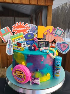 90s cake in neon colors with retro candies and toppers. rope gum, candy necklace, nerds, push pop. ring pop, 90s Style Birthday Cake, 90s Birthday Cupcakes, 30th Birthday Cake 90s Theme, 90s Inspired Cake, Back To The 90s Birthday Party, Y2k Birthday Party Theme Cake, 90s Party Inspiration, 90s Birthday Party Theme For Adults Cake