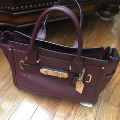 Gently Used Coach Bag. Over $400 Retail. No Rips, Stains Or Tears Shoulder Strap Included Maroon Color Burgundy Coach Bag With Detachable Handle, Coach Burgundy Shoulder Bag With Removable Pouch, Coach Burgundy Shoulder Bag With Gold-tone Hardware, Coach Black Bags With Silver-tone Hardware, Coach Satchel, Black Coach Bag With Silver-tone Hardware, Satchel Tote Bag, Black Leather Satchel, Vintage Leather Bag