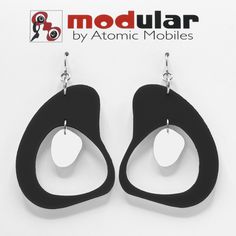 "<---------- SEE THEM IN MOTION!! Modern art earrings inspired by mid century modern retro design and my hanging art mobiles. Wearable art! Custom handmade by me in my studio in Los Angeles. No-worry, no-pain hypo-allergenic titanium ear wire, stainless steel rings, and adorably mod acrylic dangle shapes. Show your mid century modern style with these modern earrings! Arrives in lovely gift box with ribbon and includes free 2020 Atomic Mobiles Art Catalog. CHOOSE FROM 2 SIZES: Medium: 2 3/4\"h Modern Dangle Plug Earrings, Modern Handmade Earrings, Modernist Black Earrings For Gift, Modernist Black Earrings As Gift, Mobiles Art, Kinetic Art Sculpture, Modern Retro Design, Mod Jewelry, Gift Box With Ribbon