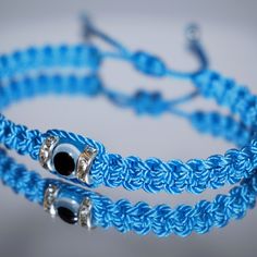 Durable Hand-Made Light Blue String Bracelet With An Evil Eye For Wrist Sizes 6 To 9 In, With An Easy To Use Zip Like Function To Fit Your Wrist, Made From High Quality Light Blue String, It Will Be Sure To Last. Wearing An Evil Eye As An Amulet Is Believed To Provide Protection Against Evil Forces. The Evil Eye Meaning Has Symbolism In Almost Every Country In The World And In Every Religion. Each Bracelet Is Carefully Handcrafted And Give Proper Time To Ensure Quality. Evil Eye Meaning, Protection Against Evil, Eye Meaning, Healing Gemstone Bracelets, Bracelets With Meaning, Daisy Bracelet, Glass Bracelet, Eye Bracelet, String Bracelet