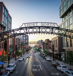 an overhead view of a street with cars driving under a sign that says short north