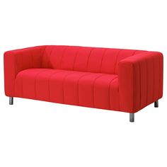 a red couch sitting on top of a white floor