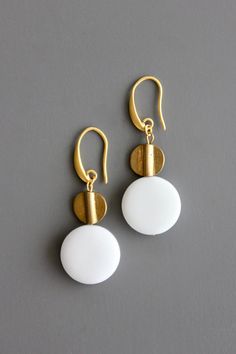 18 carat gold plated brass hook and white agate. 2.25 inches. Bronze Jewelry With Brass Hardware For Gift, Gold Agate Drop Earrings, Gold Round Agate Jewelry, White Pearl Drop Earrings In Brass, Elegant Brass Jewelry With Brass Hardware, Elegant Jewelry With Brass Hardware, White Gold Plated Jewelry With Ear Wire, Handmade Gold Agate Earrings, Nickel Free White Gold Plated Earrings