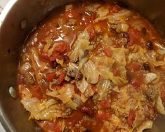 a pot filled with lots of food on top of a stove