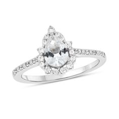 Start your endless love story with this unique pear-shaped white lab-created sapphire and diamond pointed frame engagement ring in white gold. Crafted in cool 10K white gold This design features a 7.0 x 5.0mm pear-shaped shimmering white lab-created sapphire at the center. The frame sparkles with alternating diamond duos and larger single diamonds. Diamonds and beaded detailing line the shank. This engagement ring delights with 1/5 ct. t.w. of diamonds. White Teardrop Halo Set Jewelry, White Teardrop Halo Jewelry, White Marquise Cut Halo Ring, Pear-shaped White Cubic Zirconia Ring, White Marquise Cut Halo Jewelry, White Pear-shaped Cubic Zirconia Ring, White Teardrop Jewelry With Prong Setting, Formal White Pear-shaped Diamond Ring, Timeless White Teardrop Jewelry