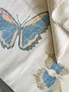 a close up view of some fabric with a butterfly on it