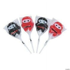 four plastic spoons with cartoon characters on them in red, black and white bags