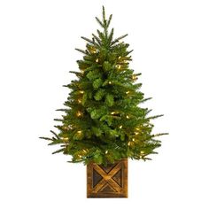 Create your own mini Christmas wonderland and rock around with this Artificial Christmas Tree. Incredibly lifelike textured branches mimic real evergreens for a sturdy construction. This pre-lit artificial Christmas tree comes with 50 clear lights and has upward-sloping branches  allowing you to decorate with mini-ornaments of your choice easily. Standing 3ft. from a decorative planter, this tree requires zero maintenance, just some fluffing and shaping thats easy with the bendable branches! Dec Blessings From God, Christmas Porch Decor Ideas, Faux Christmas Trees, Fir Christmas Tree, Warm White Lights, Pre Lit Christmas Tree, Cone Trees, Mini Ornaments, Small Christmas Trees