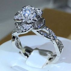 a white gold ring with diamonds on it