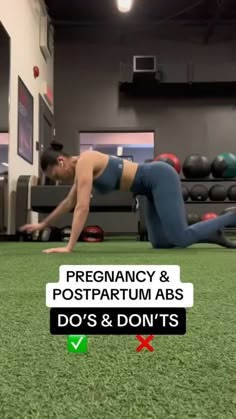 a man is doing push ups on the grass in a gym with an exercise ball