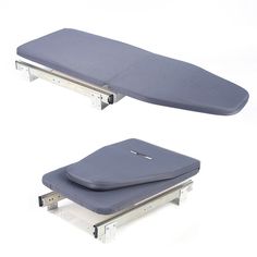 two foldable cots sitting next to each other on top of one another,