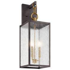 an outdoor light fixture with two lights on the front and back of it, hanging from a