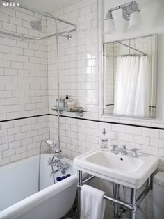 a white bath tub sitting next to a white sink in a bathroom under a mirror