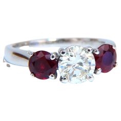 Three Stone Reds 1.06ct. Natural round diamond ring GIA Certificate # 6227298105 M-color VVS2 clarity Very good Cut / Full cut Brilliant 1.04ct Side natural (2) Rubies Vivid Deep Reds & Clean Clarity. 5mm diameter Platinum Ring size: 6 (Complimentary resizing available) 7mm depth. $22000 Appraisal certificate will accompany. Gia Certificate, Round Diamond Ring, Round Rings, Platinum Ring, Classic Ring, Ruby Ring, Three Stone Rings, Deep Red, Three Stone