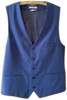 Navy Sleeveless Vest With Pockets, Blue Workwear Vest With Pockets, Fitted Blue Sweater Vest For Winter, Navy Sleeveless Vest For Winter, Formal Winter Sleeveless Vest, Formal Sleeveless Winter Vest, Blue Sleeveless Vest For Work, Fitted Navy Sleeveless Vest, Blue Sleeveless Vest For Workwear