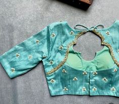 Hand embroidered ready made saree blouse / crop top/stitched saree blouse usa / turquoise blue saree blouse/ hand embroidered blouse/zardosi blouse/sea green saree blouse/ pure silk blouse/teal blue maggam work blouse        It is very true that a perfect blouse is the one which makes your saree look stand out !! If you find one of such a style that you have been wanting to have then dont let it go !! we carry such unique trending blouses that instantly add a stylish look to any saree !!     Well..!! we understand that you may not get in your desired size/pattern, here you go with customization according to your size/pattern which we can deliver in 1 week of time period !!      Here is a beautiful Hand embroidered saree blouse in light sea green color that has simple yet unique hand embroi Designer Embroidered Turquoise Lehenga, Designer Turquoise Embroidered Lehenga, Turquoise Unstitched Blouse Piece, Fitted Dola Silk Top With Handwork, Fitted Turquoise Anarkali Choli, Turquoise Unstitched Blouse For Festive Occasions, Turquoise Unstitched Blouse For Diwali, Turquoise Blouse Piece With Cutdana For Festivals, Turquoise Blouse Piece With Cutdana For Festive Occasion