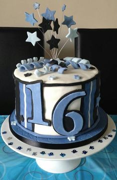 a blue and white birthday cake with stars on it