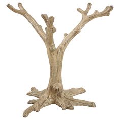 a wooden table that has some branches on it and is made out of drift wood