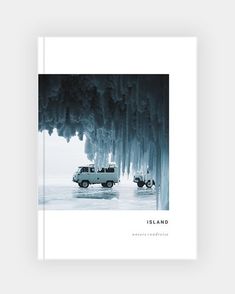 a book with an image of two cars parked in front of ice covered trees