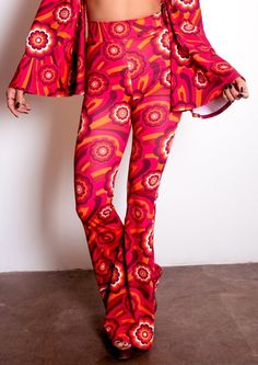 Say hello to your new favorite pants! Our Highwaist Bell Bottoms in Red Flowers are sure to be your go-to for those '70s-style grooves and disco nights! With their throwback style and fun pattern, you'll be turning heads in this retro pair of pants. Shake your groovy thing! This listing is for the pants ONLY. They are pictured with our matching Disco Ring Top. The pants are HIGH-WAISTED. The rise is approx 12". The inseam is 34.75", they are cut a little longer to wear with heels. They are made Retro Flare Bottoms For Festival, Retro Flare Bottoms For Summer, Summer Retro Flare Bottoms, Retro Style Fall Festival Pants, Retro Fitted Pants For Festival, Retro Spring Flare Pants, Retro Festival Fitted Pants, Retro Multicolor Fall Pants, Groovy Flare Stretch Bottoms