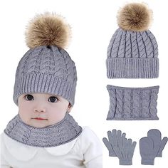 a baby wearing a hat, mittens and gloves with two pom - poms