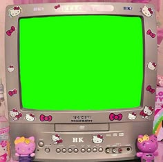 an old television with hello kitty stickers on it