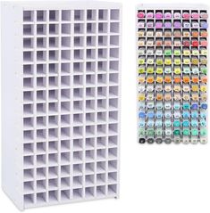 a large white storage rack filled with lots of different colored paint tubes and ink bottles