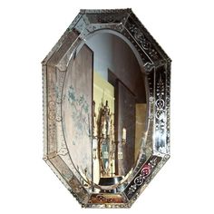 an ornate mirror is hanging on the wall