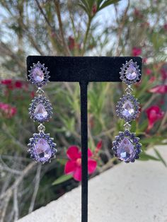 Purple Jeweled Dangle Earrings, Purple Rhinestone Dangle Jewelry, Purple Rhinestone Crystal Earrings For Party, Purple Party Earrings With Sparkling Stones, Party Purple Crystal Rhinestone Earrings, Purple Dangle Rhinestone Jewelry, Elegant Lavender Crystal Earrings For Party, Elegant Purple Crystal Earrings For Evening, Purple Sparkling Stones Earrings For Party