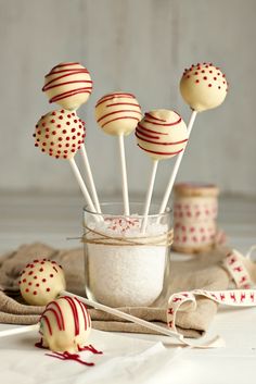 some cake pops are in a glass jar