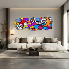 a living room with white couches and colorful artwork on the wall