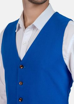 This Royal Blue Vest is designed with stretch cotton for comfort, and features a vibrant royal blue hue that is modern and bold. Looking to stand out and make your presence known? This vest is a great choice. Casual Blue Vest For Workwear, Casual Blue Vest For Work, Blue Vest Top For Work, Blue Cotton Vest For Spring, Fitted Blue Vest For Workwear, Blue Fitted Vest For Work, Blue Sleeveless Vest For Workwear, Blue Sleeveless Vest For Work, Fitted Blue Vest Outerwear