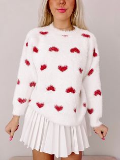 Loving Life Heart Sweater | Sassy Shortcake | sassyshortcake.com Cozy Crew Neck Top With Heart Print, White Long Sleeve Acrylic Top, White Acrylic Top For Winter, Cute Heart Print Tops For Winter, Trendy White Acrylic Tops, Winter White Tops With Heart Graphic, White Tops With Heart Graphic For Winter, White Heart-shaped Sweater For Spring, Winter Knit Tops With Heart Print