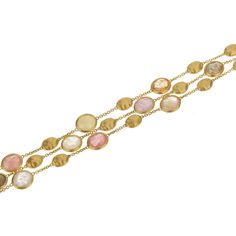 The Marco Bicego Siviglia Gemstone Yellow Gold Bracelet is an embodiment of luxurious elegance and artisanal craftsmanship. This exquisite piece features three rows of alternating vibrant gemstones and hand-engraved pebbles, meticulously crafted in 18k yellow gold. Each pebble, with its unique hand-engraved texture, showcases the traditional Italian bulino technique, giving the bracelet a satin-like sheen that catches the light beautifully. The carefully selected gemstones add a colorful brilliance to the bracelet, creating a harmonious balance between the warm glow of yellow gold and the lively hues of the stones. This arrangement provides a captivating visual rhythm and depth, making the bracelet a statement piece that's both sophisticated and versatile. Secured with a robust and elegant Marco Bicego, Yellow Gold Bracelet, Jewelry Business, Hand Engraving, Gemstone Bracelet, Luxury Jewelry, Online Boutique, Jewelry Pieces, Jewelry Collection