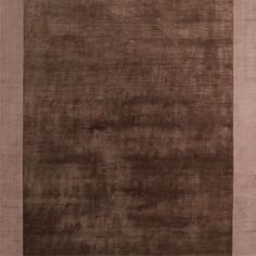 an area rug with brown and beige colors