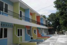 multi - colored apartment buildings with balconies and balconyes on the first floor