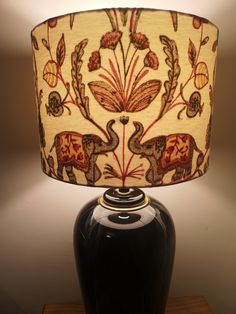 a lamp with an elephant design on it