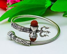 Vintage antique design handmade 925 sterling silver amazing rudraksha beads bahubali shiva trident trishool kada bangle bracelet, excellent gifting jewelry from Rajasthan India. Metal-925 Sterling silver. Item type-Bangle/Bracelet/kada Weight-22.590 grams approx. Width-3.5.mm bangle size Stamped-925. Size-Select your size from option finish-Oxidized. Excellent gifting jewelry Adjustable Silver Jewelry For Puja, Spiritual Bangle For Puja, Symbolic Jewelry For Navratri Puja, Silver Spiritual Jewelry For Navratri, Symbolic Bracelet Jewelry For Puja, Symbolic Jewelry For Puja And Navratri, Spiritual Adjustable Jewelry For Navratri, Adjustable Spiritual Jewelry For Navratri, Adjustable Spiritual Jewelry For Diwali