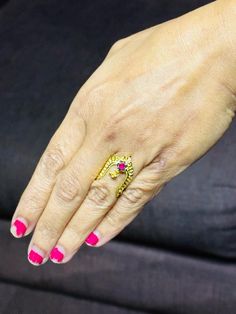 traditional 22 karat gold vanki ring with red stone
  most vanki rings are self adjustable in size.    - 235-GVR315 - in 2.600 Grams for USD $349.14 USD. 
Made in India by Totaram Jewelers Online this product is in Gold - 22 Karat BIS Hallmark 916 Gold  & is an excellent gift for Adult - Women. Ships fully insured with secured guaranteed delivery for free with your order over $250 from New Jersey USA & comes with 30 days exchange policy. Gold Ruby Ring For Marriage In Fine Jewelry Style, Fine Jewelry Gold Ruby Ring For Marriage, Gold Ruby Ring For Marriage, Fine Gold Ruby Ring For Marriage, Traditional Hand Set Rings For Marriage, Yellow Gold Ruby Rings For Marriage, Toe Rings For Anniversary And Festivals, 22k Gold Jewelry For Puja, 22k Yellow Gold Ruby Ring For Anniversary