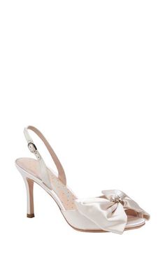 A faux pearl and jewel embellishments accentuate a satin bow at the vamp of a glamorous sandal secured by an adjustable slingback strap. 3 1/4" heel Textile upper/leather lining and sole Imported Hp Wedding, Kate Spade Bridal, Bridal Glam, Kate Spade Style, Ivory Bridal, Bow Sandals, Size 11 Heels, Bow Heels, Kate Spade Shoes