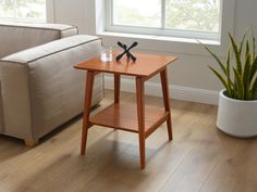 a small wooden table sitting next to a couch