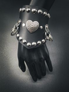 This "Savage Vixen" cuff is subtle but eye catching! Get this flawless design today! You will not regret it. ✨ Adjustable 8" to 9" inches. ✨ 3-1/2 inches at widest point ✨ Steel snaps ✨ Sturdy 7-8 oz leather Heavy Metal Fashion, Goth Clothes, Leather Heart, Metal Fashion, Goth Outfits, Heavy Metal, Real Leather, Rocker, Cuff Bracelets