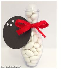 a bottle filled with white and red candies