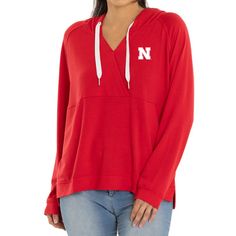 Top off any Nebraska Huskers look with this Christine Cross Front Tri-Blend Pullover Hoodie. It features team graphics and a unique cross front design. Tailgating before the game or cheering in the stands, show school spirit with this Nebraska Huskers hoodie. Fall Team Spirit Hoodie Top, Team Spirit Hoodie For Fall, Team Spirit Long Sleeve Tops With Drawstring Hood, Fall Sports Event Hoodie Tops, Hooded Tops With Team Logo For Fans, Hooded Tops With Team Logo For Fan Gear, Team-colored Hooded Top For Fan Gear, Athleisure Tops For Winter Game Day, Game Day Team Spirit Hooded Top