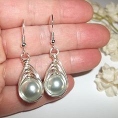 Wire Wrap Earrings Grey Pearl Silver Beaded Handmade Dangle Drop Jewelry C355 This Costume Jewelry Beaded Earring Set Are Brand New Nwt And Handmade By Me - Wvluckygirl. Handcrafted With Gray Acrylic Faux Pearl Beads. These Were Wire Wrapped With Silver Toned Tarnish Resistant Wire To Form A Basket Weave Around The Beads. The Pair Dangle And Drop From 925 Sterling Silver French Fishhook Ear Wires For Her Pierced Ears. From Top To Bottom They Measure 1 3/4 Inches Tall And Just Over 1/2 Inch Wide. Wire Earrings Handmade Unique, Silver Wire-wrapped Teardrop Earrings, Nickel-free Silver Dangle Pearl Earrings, Silver Dangle Wire-wrapped Pearl Earrings, Silver Wire-wrapped Earrings For Party, Silver Wire Wrapped Earrings For Party, Nickel-free Silver Drop Pearl Earrings, Elegant Metal Teardrop Earrings With Wire Wrapped Detail, Elegant Metal Teardrop Earrings Wire Wrapped