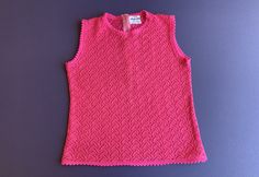 Vintage 1970's Sweater ~ Hot Pink, Sleeveless, Zips Up The Back, And Very Soft ~ Made In Japan ~ Great Quality And Condition ~ Size Small I will be mailing this Priority Mail and First Class International. Measurements Bust 34 Inch Waist 30 Inch Length 19 Inch Retro Stretch Tank Top, Fitted Sleeveless Pink Sweater Vest, Retro Fitted Sleeveless Tank Top, Fitted Retro Sleeveless Tank Top, Retro Pink Sleeveless Top, Vintage Sleeveless Sweater Vest For Spring, Retro Fitted Sleeveless Vest, Vintage Fitted Tank Vest, Retro Sleeveless Vest Top