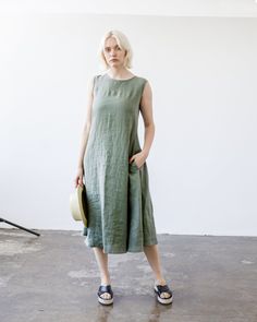 "Our endlessly romantic moss green maxi dress - representation of simplicity and magnificence. This dress is tailored from Lithuanian washed linen fabric and comes with matching belt to extenuate the waistline. FABRIC: 100% softened Lithuanian linen COLOR: Please choose the color from the side menu. STYLE: Maxi sleeveless dress with side pockets, comes with matching belt. Features fold at the back. If you need other style, length, sleeves length or color, please contact us. SIZE CHART: 2 US/ 6 A Olive Sleeveless Midi Dress, Sleeveless Olive Maxi Dress For Spring, Green Linen Sleeveless Summer Dress, Chic Green Linen Midi Dress, Chic Green Midi Linen Dress, Green Linen A-line Midi Dress, Green A-line Linen Midi Dress, Olive Sleeveless Maxi Dress For Summer, Spring Olive Linen Dress